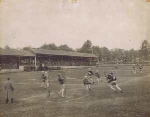 This photograph of a senior game at Queens Park dates from three years after the pro game died in 1924. It clearly shows the considerable slope of the field along the grandstand.